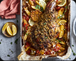 Slow-roasted lamb shoulder with potatoes and herbs